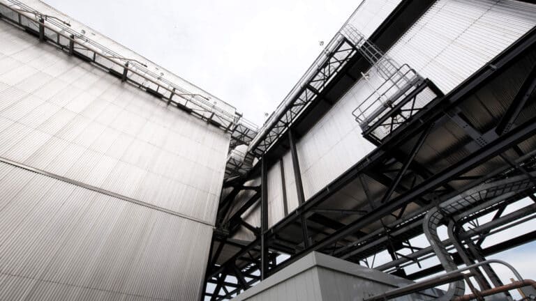 Upward angled view of exterior of power plant building