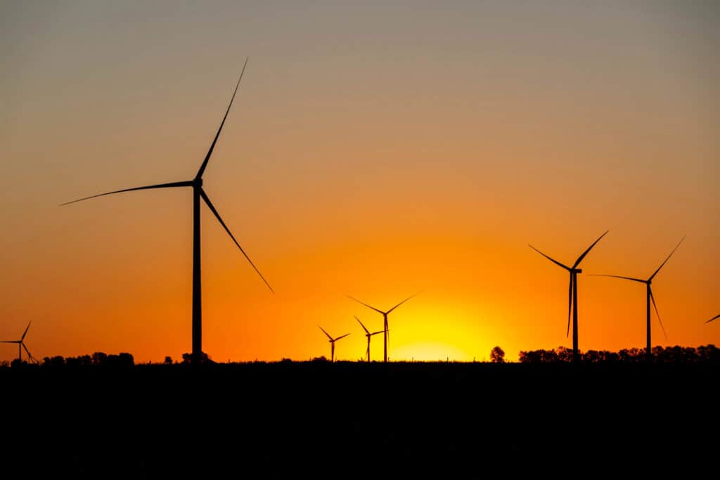 wind turbines shadow with sunset