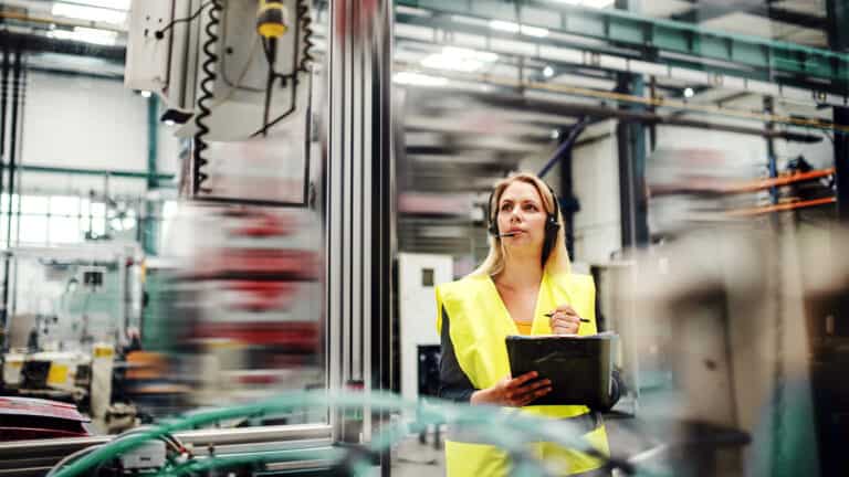 Worker with headset and clipboard