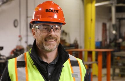 Scott Frazier in safety vest and hard hat