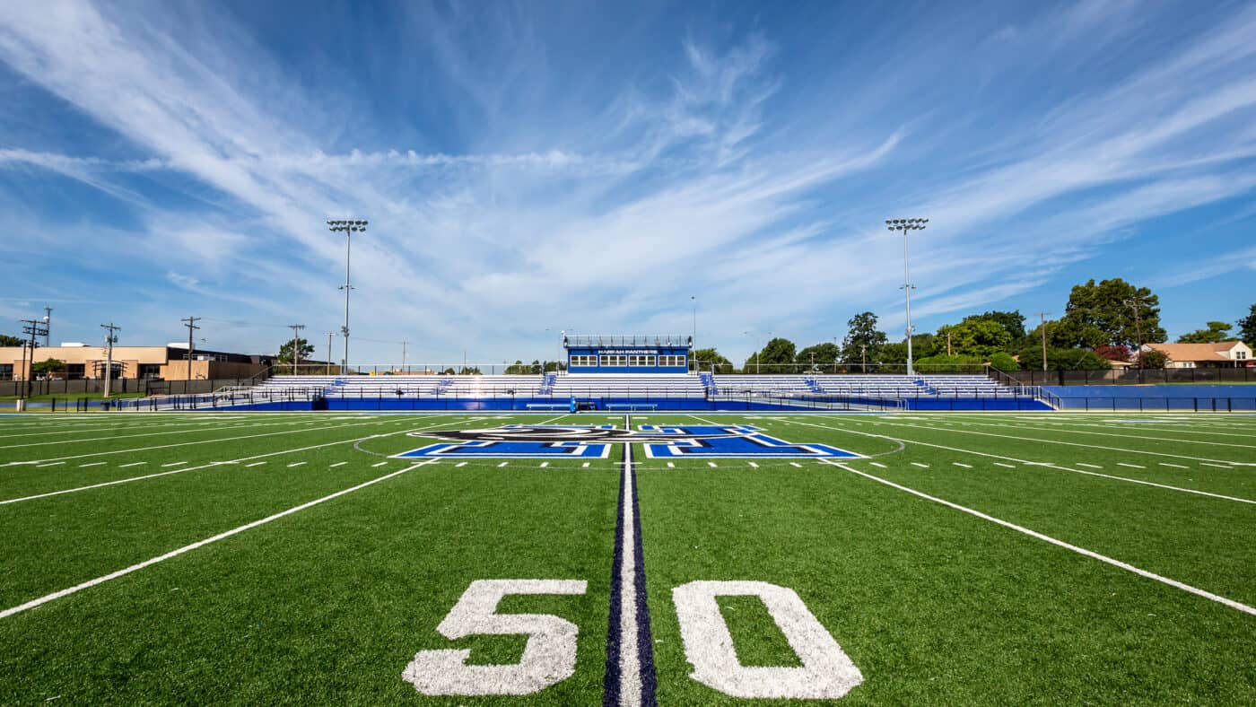 Harrah Public Schools - Evans Field 50-Yard Line