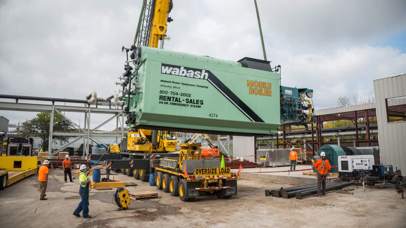 Milwaukee Regional Medical Center - Thermal Power Plant Construction Site with Crane Lifting Mobile Boiler