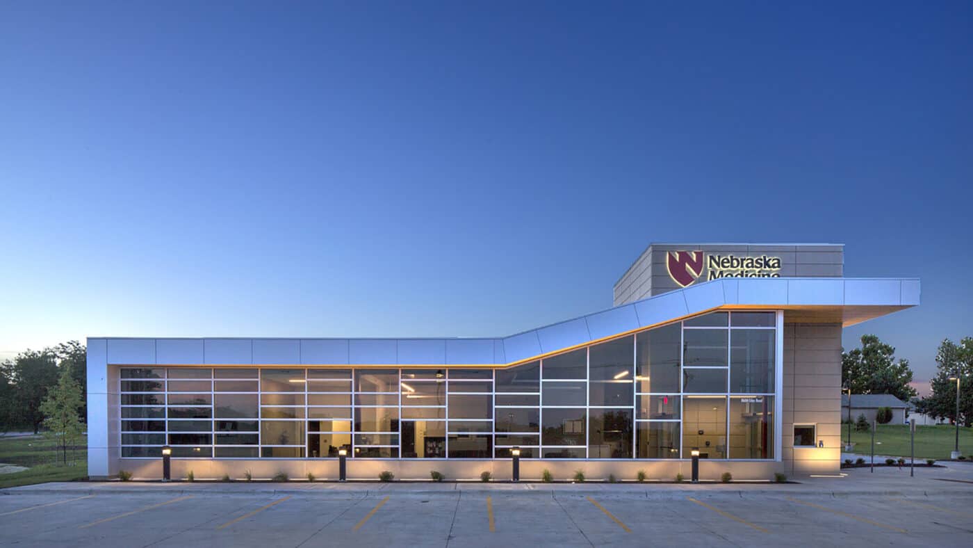 Nebraska Medicine - Primary Care Clinic Exterior Lit at Dusk