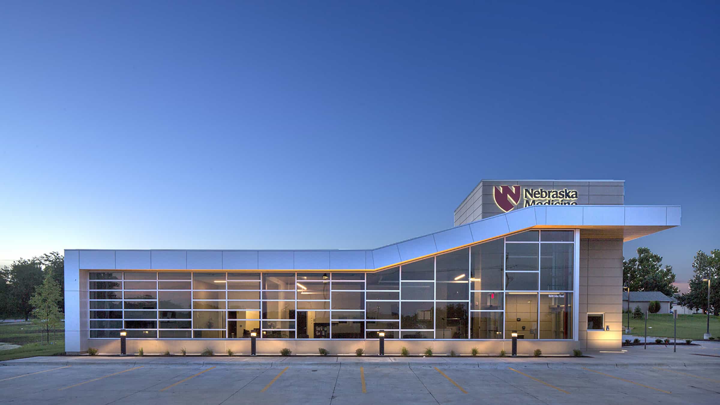 Nebraska Medicine - Primary Care Clinic Exterior Lit at Dusk