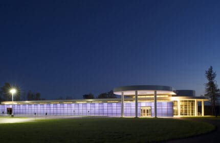 Oldenburg Group - Technology Center Building Exterior Lit at Night