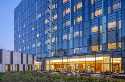 Sutter Health CPMC Van Ness Campus Hospital Exterior Lit at Night, Showing Exterior Courtyard Seating