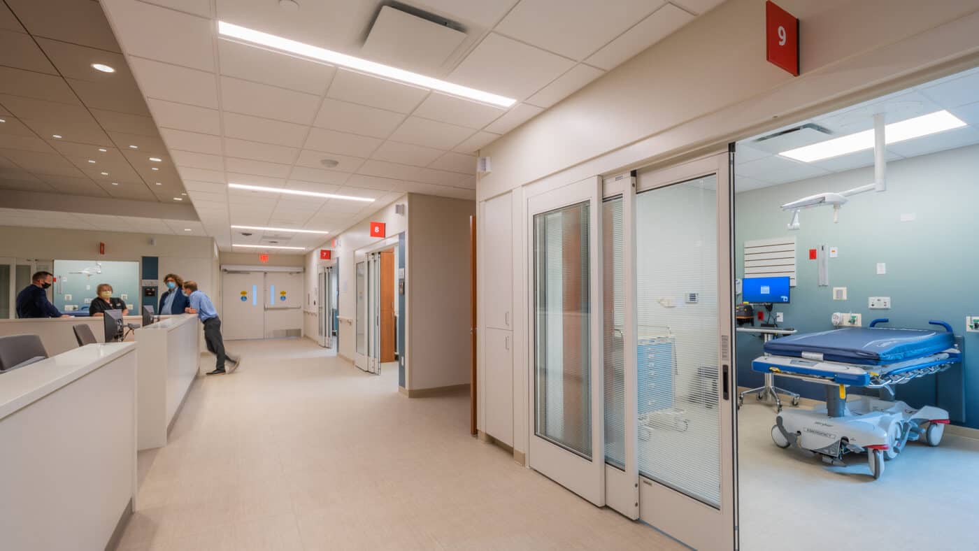 ThedaCare Medical Center - Berlin - Emergency Department Patient Room with Floor Desk and Medical Personnel in Background