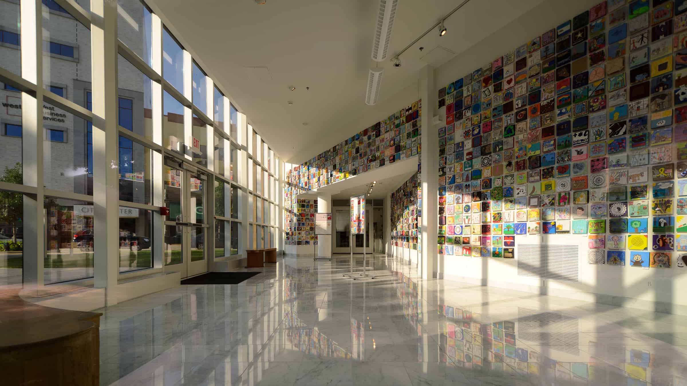 Trout Museum of Art - Interview View of Entrance with Wall of Art Visible and View to Downtown