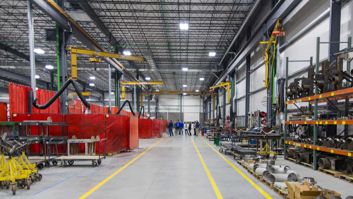 Tweet/Garot Production Facility Interior View of Walkway in Production Facility with Overhead Lifts Visible