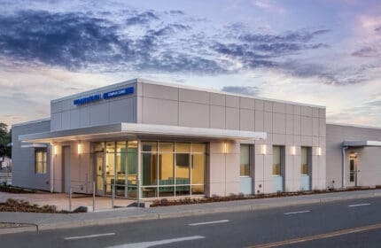 University of California - Davis - Health Clinic - Exterior View of Building at Dusk from Street