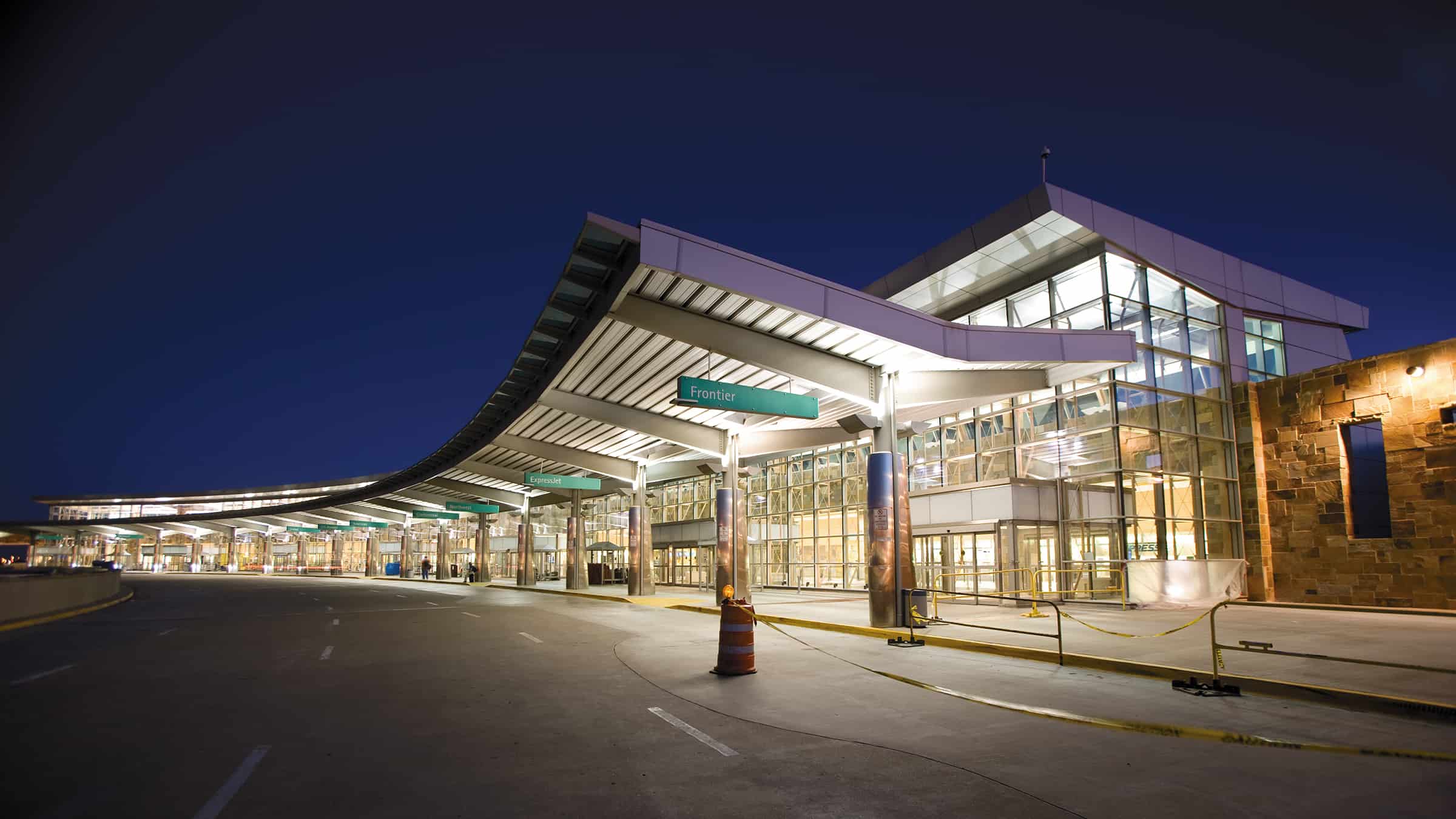 Will Rogers World Airport - Exterior View of Building Lit at Night, Exterior Overhang for Arrivals and Departures