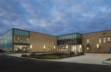 Fairfield Medical Center - exterior view of building with parking lot, building is lit at dusk