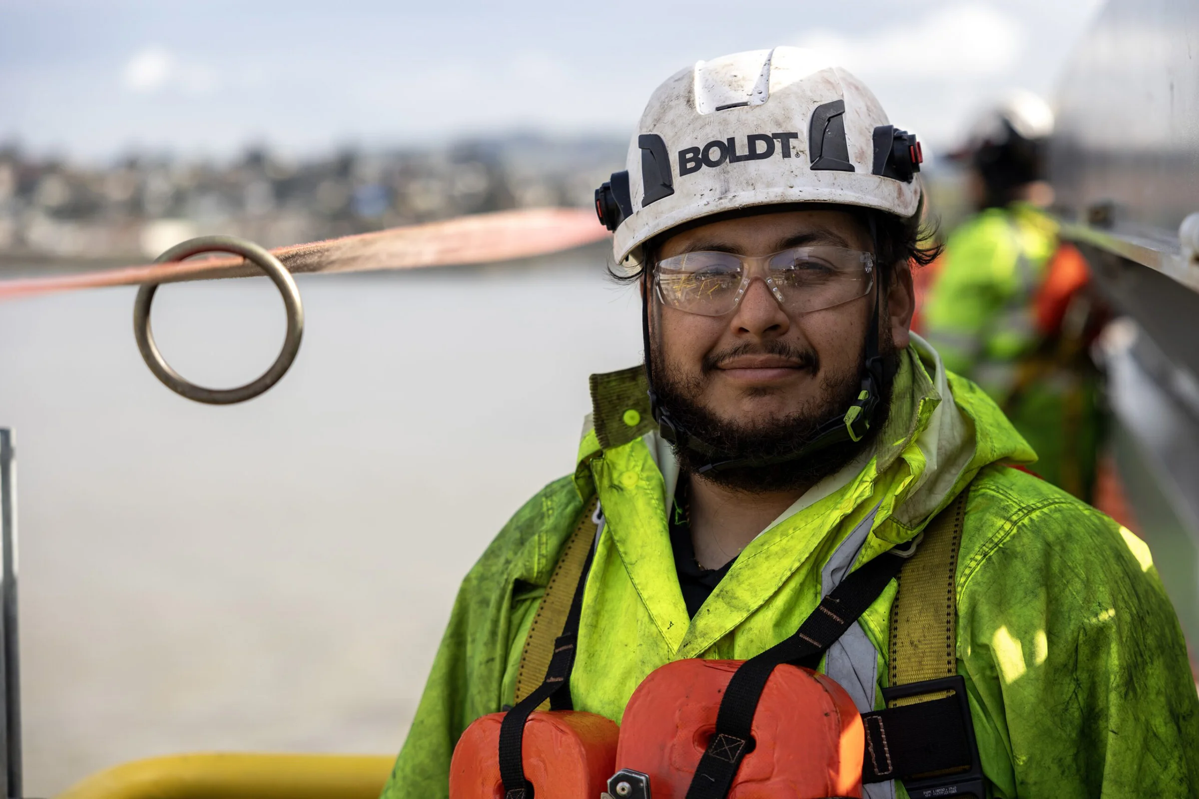 Boldt construction worker in safety jacket and helmet